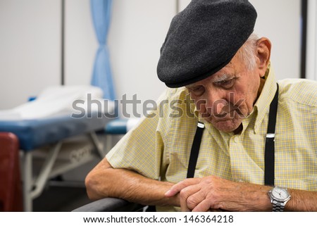 Elderly eighty plus year old man receiving physical therapy.