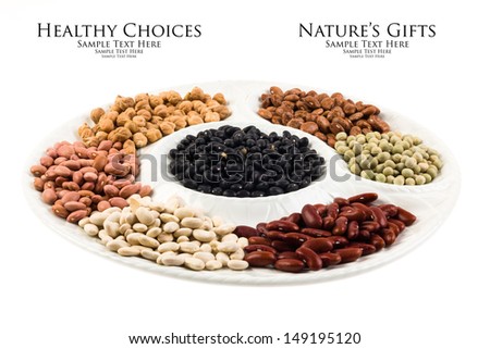 Collection of various beans on a round white plate isolated on a white background.