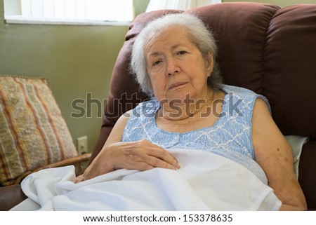 Elderly eighty plus year old woman in a home setting.