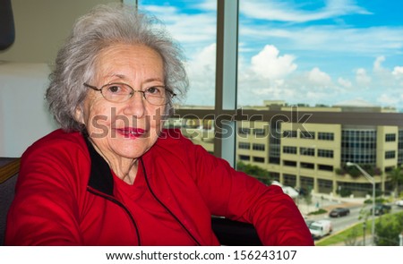 Elderly eighty plus year old woman in a medical office setting.