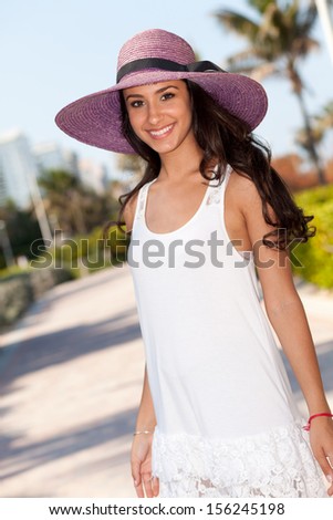 Beautiful multicultural young woman enjoying Miami Beach.