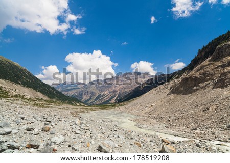 Swiss mountain landscape of the Morteratsch Glacier Valley hiking trail in the Bernina Mountain Range of the Bundner Alps.