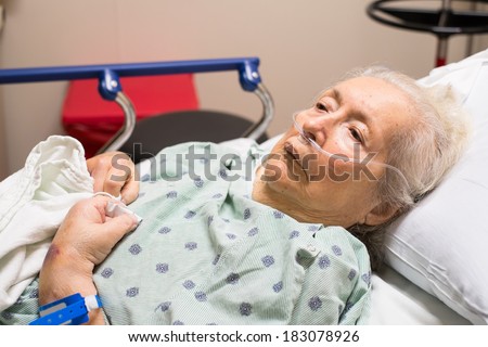 Elderly eighty-plus-year-old woman in a hospital bed.