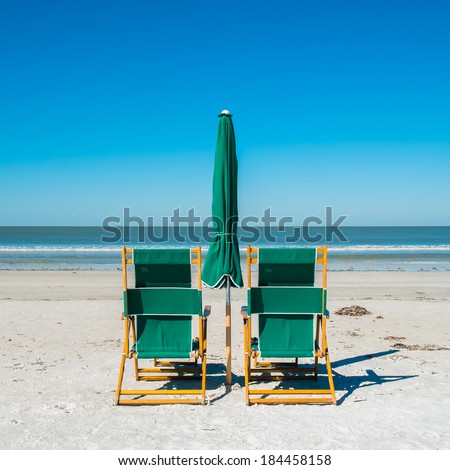 Lounge chairs along popular Fort Myers Beach on the west coast of Florida.