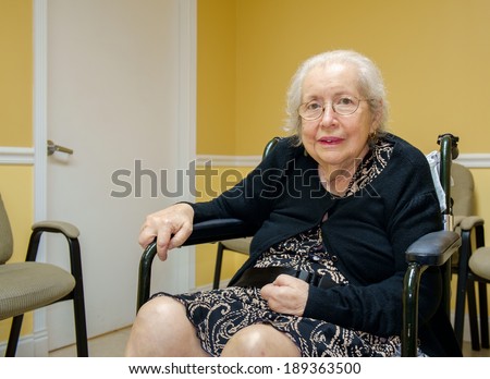 Elderly eighty plus year old handicap woman in a medical office setting.