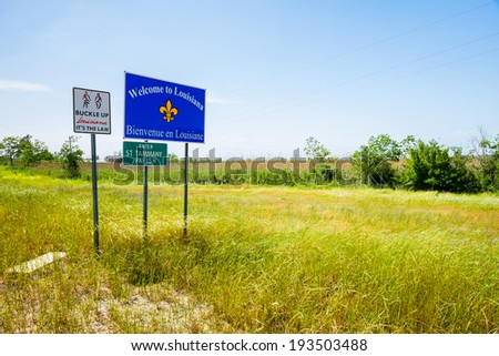 Louisiana state sign along a rural road.