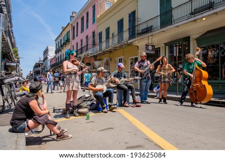 NEW ORLEANS, LOUISIANA USA - MAY 1, 2014: Unidentified street performers playing blue grass style music in the French Quarter district in New Orleans, Louisiana.