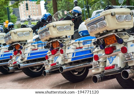 CHARLOTTE, NORTH CAROLINA USA - OCTOBER 10, 2013: Charlotte police department motorcycles lined up outside a municipal downtown building.