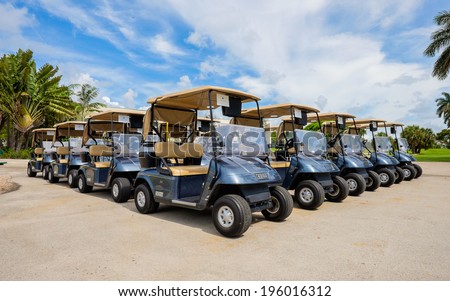 MIAMI BEACH, FL USA - MAY 30, 2014: Large group of golf carts lined up waiting for golfers at the popular Miami Beach Golf Club.