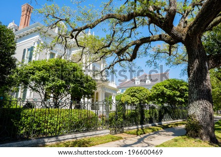 Historical southern style homes along Saint Charles Avenue in New Orleans, Louisiana.