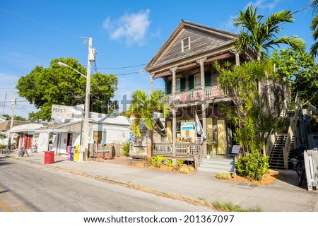 KEY WEST, FLORIDA USA - JUNE 26, 2014: A typical Key West street in the historical district with neighborhood restaurants and retail stores.