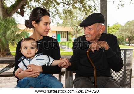 Elderly eighty plus year old man with granddaughter in a outdoor setting.
