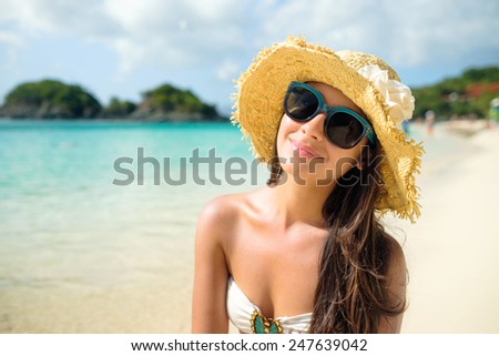 Beautiful young multicultural woman enjoying a Caribbean beach in Saint John in the United States Virgin Islands.