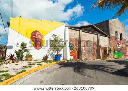 Key West, Florida USA - March 2, 2015: A vintage brick building covered with graffiti art in the Bahama Village District of Key West.