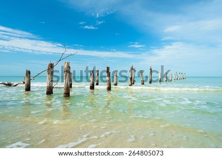 Rustic decaying pier along Fort Myers Beach on the west coast of Florida.