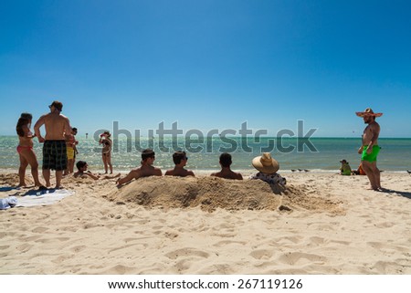 Key West, Florida USA - March 3, 2015: Young college students enjoying spring break on a Key West beach in Florida.