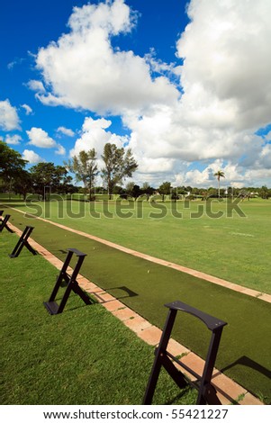 Portrait view of a golf course practice driving range.