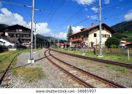 Swiss Alps - Railroad tracks running through a small swiss mountain village located in the Prattigau Valley of the city of Kublis in the Graubunden canton of Switzerland.