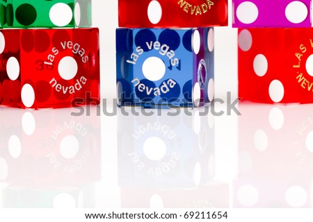 Pairs of colorful casino gaming dice from Las Vegas, Nevada on a white background.