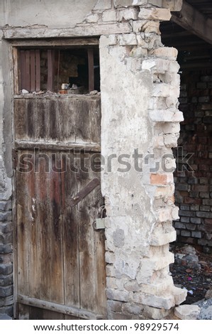 view of an old wooden door in ruins