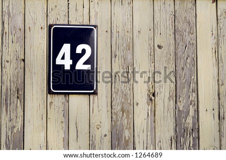 Street number 42 on old fence background