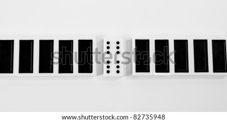 A pile from the bones of domino is isolated on white