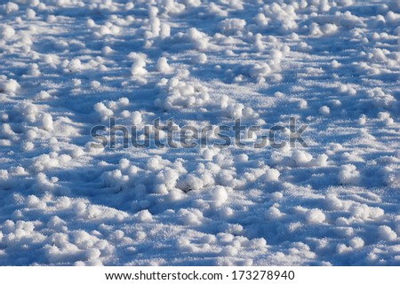 snow crystal structure on field at winter