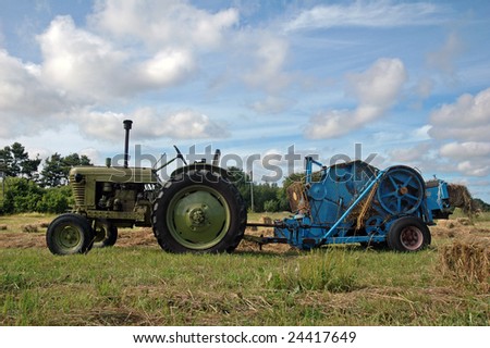 vintage tractor works on field