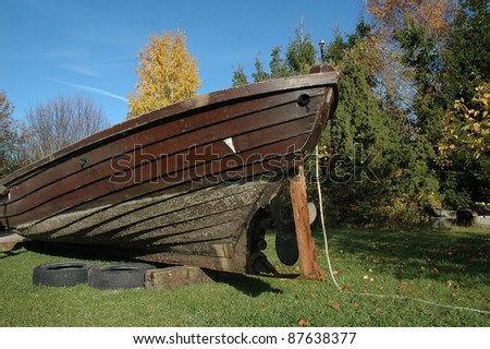 old wooden fishing boat on land