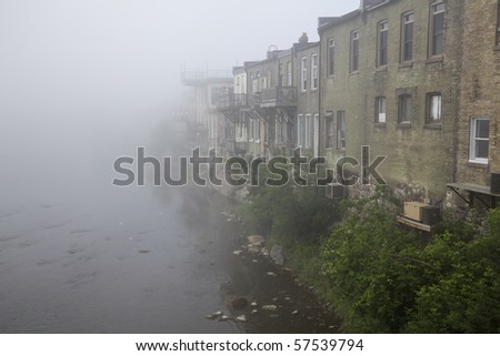 Morning river mist rising from the Grand River as it flows past Paris, Ontario, Canada