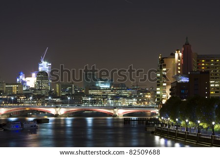 London Financial District at night. Office blocks and River Thames.