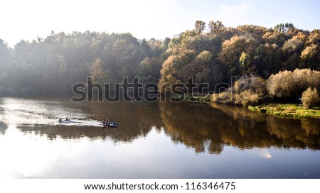 River morning landscape with kayaks and athletes on the river