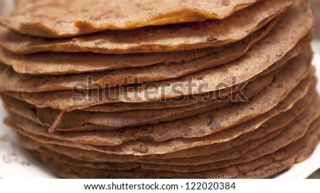 Brown pancakes from beef livers are put at each other