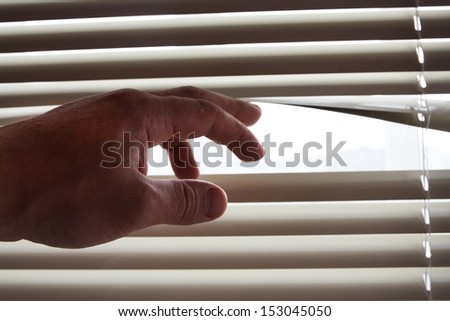Bright sunlight when opening by a hand of curtains of blinds