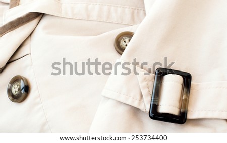 Texture - a white women's coat with inserts of coffee color