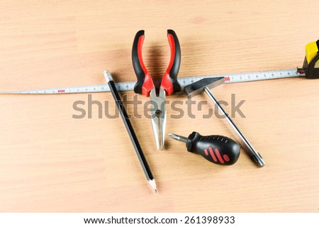 Various tools for working around the house in the background Wooden floor