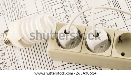 luminescent lamp socket and plug on a background of drawings circuits