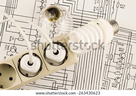 Different lamp with socket and plug on a background of drawings circuits