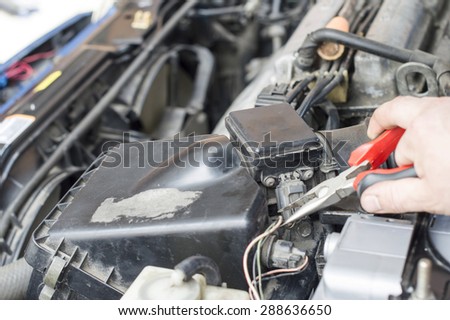 The process of repair wiring car using pliers