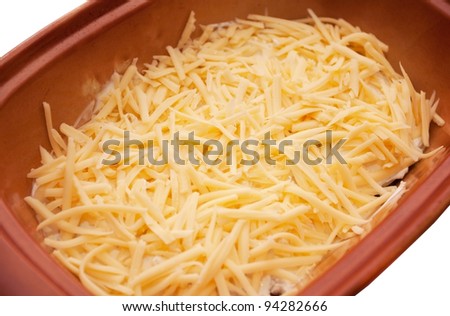 Meat dish the covered grated cheese in ceramic ware