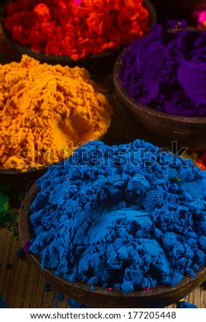 Colorful, finely powdered Indian pigments. Complementary colours: blue and orange. Focus on blue.