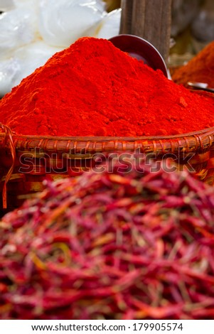 Big mounds of hot, spicy red chilli powder for sale at a market in Myanmar (Burma)