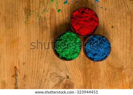 A real world rendition of the RGB colour system used in digital environments: red, green and blue powder pigments.