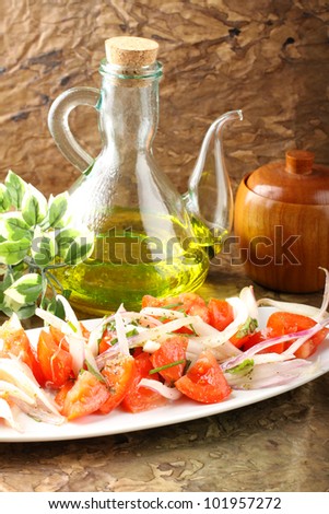 Fresh tomato and onions salad on complex background