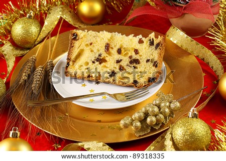 Panettone christmas cake on table with golden decoration