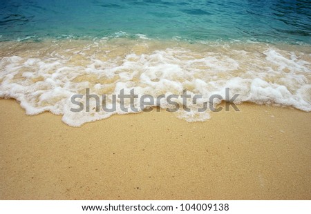 Beach wave sea sand sun water in thailand beach for background and design