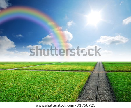 Alone way green grass cloudy blue sky to destination and green way to the future rainbow