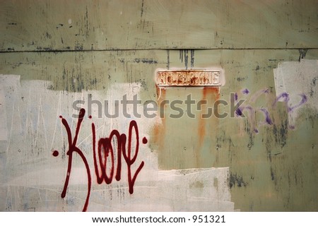 abstract painted garage door with some graffiti