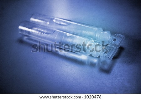 Medical - blue vials. Intentional use of hi-speed ISO to achieve gritty, film-noise effect.