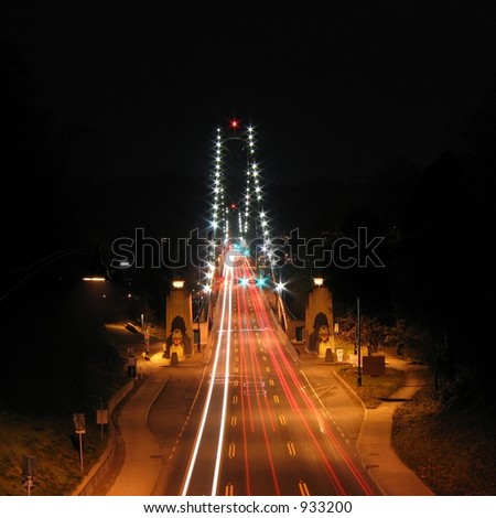 Lions Gate Bridge in Vancouver, British Columbia  Canada. At night with Christmas ribbons on the lions.